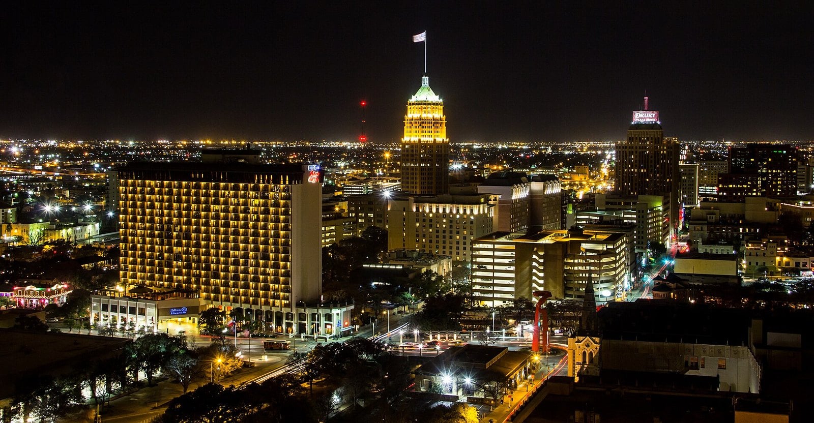 The downtown San Antonio skyline at night, with the Tower Life Building lit gold